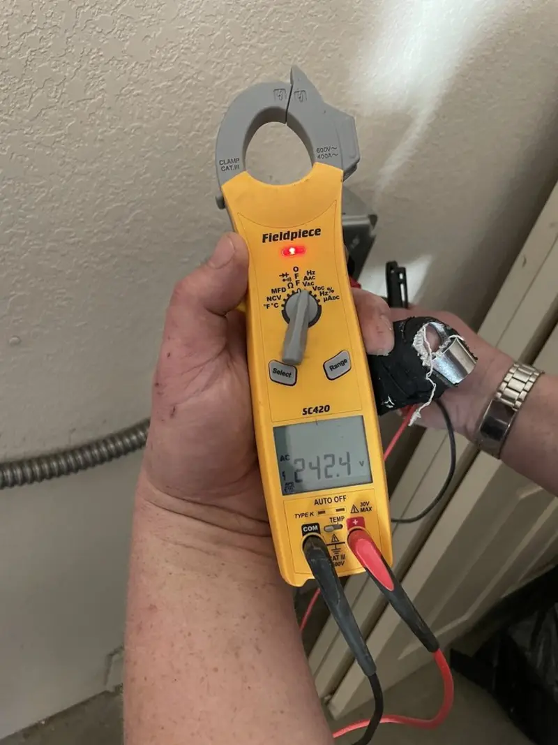 Voltage testing with clamp meter during Generator Installation in Pembroke Park